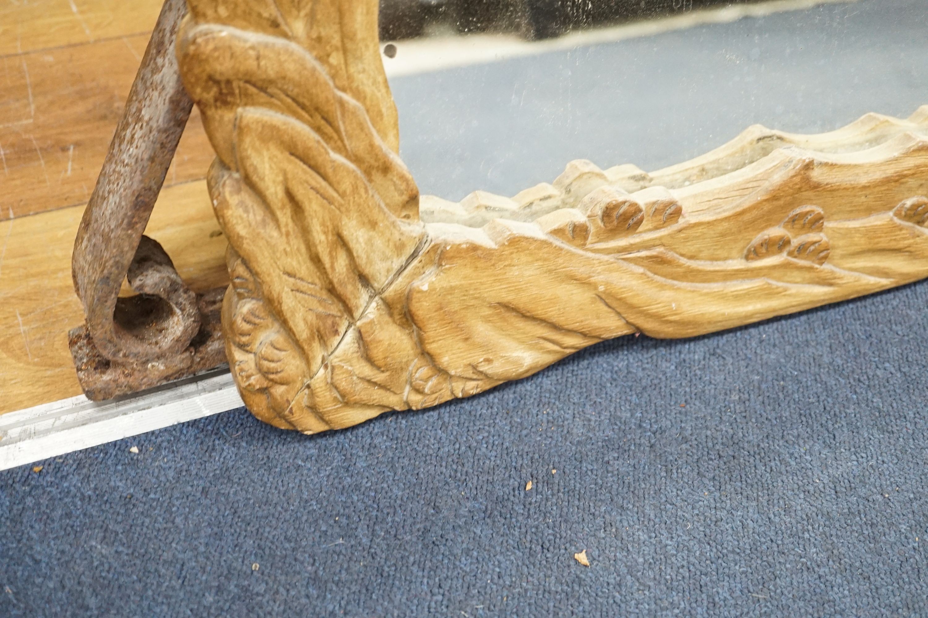 A Japanese 'squirrel and vine' rectangular carved wood mirror, width 57cm, height 96cm